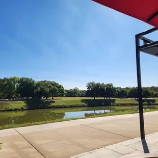 Patio facing the river. Good spot for people watching on the weekend. Always runners and bikers in the morning!