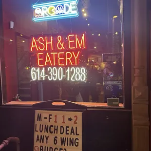a sign in front of a restaurant