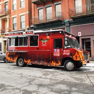 a red food truck on the street