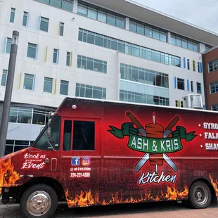 a food truck parked in front of a building