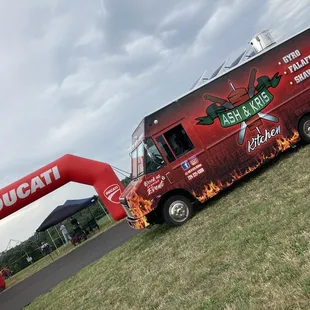 a food truck parked in a field