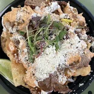 Flank steak over wonton chips