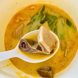 a bowl of soup with a spoon in it