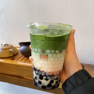 Matcha latte with oatmilk and strawberry puree