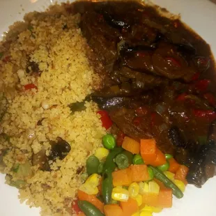 Vegan Burger Patty with Brown Portabella  mushroom sauce, cous cous and mixed vegetables