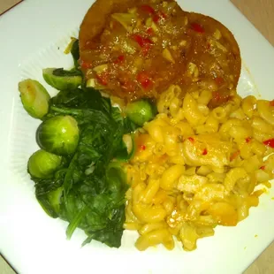 Vegan Veggie Patty with fresh steamed spinach and broccoli with baked vegan macaroni and cheese.