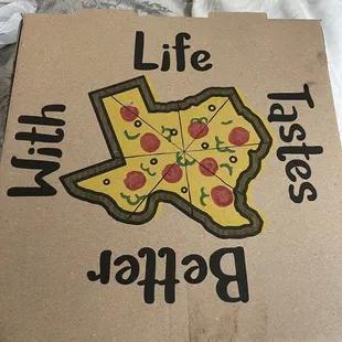 a cardboard box with a picture of a pizza on it