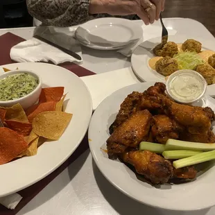 Buffalo Chicken Wings, spinach artichoke dip, Our Very Own Crab Cakes