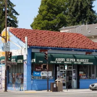 a blue building with a red roof