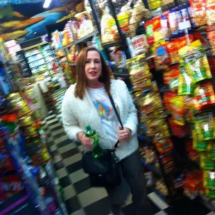 a woman standing in a grocery store