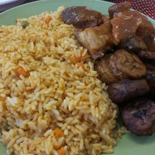 Coconut rice, plantain n meats. The rice was a bit bland and overcooked for me. The plantain a bit dry. The meats flavoful but fatty.