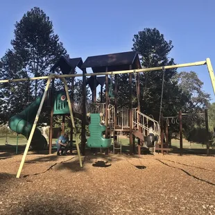 Parks playground with swings.