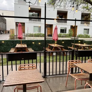 a patio with tables and chairs