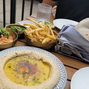 Hummus (with the mushroom and feta cheese add on), fries, and.... can&apos;t remember the red dish