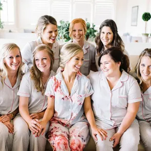 Bridesmaids celebrating while getting ready before the wedding