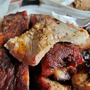 One of the slices of smoked pork shoulder on top of the ribs &amp; tips.