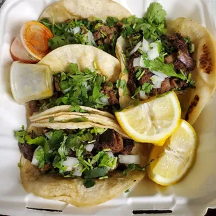 Tacos de lengua and steak