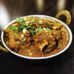 Goat meat (Bone in) spiced mildly in a special curry gravy and herbs!