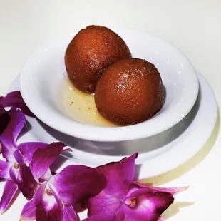 Gulab Jamun - Freshly made milk balls, lightly fried, dipped in sweet syrup!