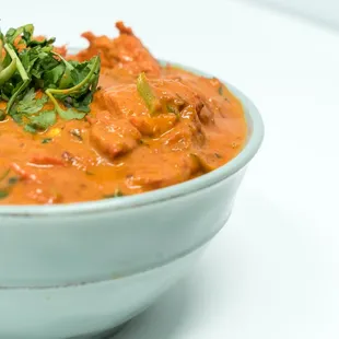 Chicken Tikka Masala Boneless chicken breast marinated in spices &amp; yogurt, tandoored in clay oven, then blended in our delicious masala