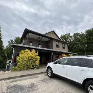 a car parked in front of a house
