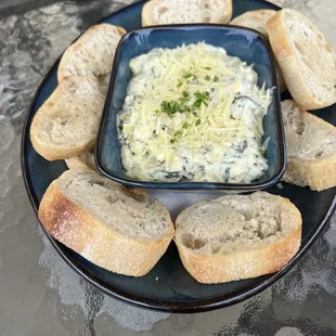 a plate of bread and dip