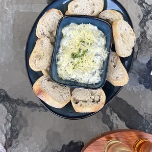 a plate of bread and dip