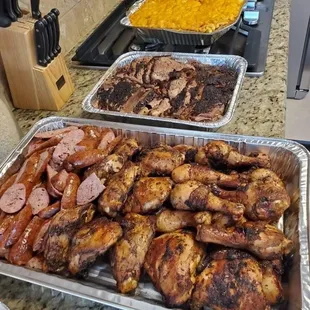 Sausage, brisket, chicken, smoked mac n cheese and potato salad