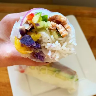 side order of vegan spring rolls - organic english cucumbers, sweet bell peppers, ube, red onions, lettuce, and rice noodles!