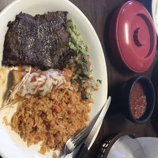 Carne Asada steak with a chicken enchilada and rice