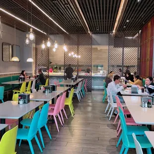 colorful chairs and tables in a restaurant