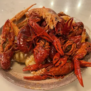 a plate of lobsters and potatoes