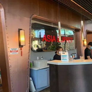 a woman sitting at the counter
