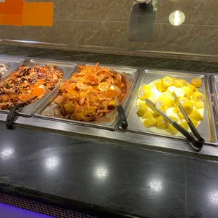 a variety of food items in a buffet