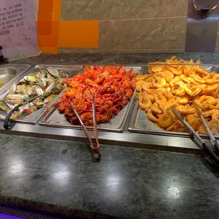 a variety of food items in a buffet