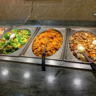 a variety of food in a buffet