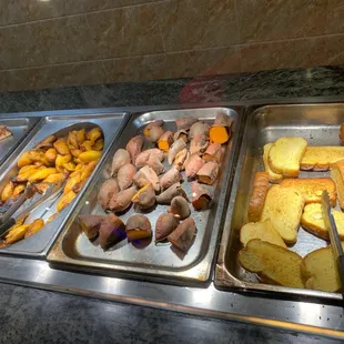 a variety of food items in a buffet