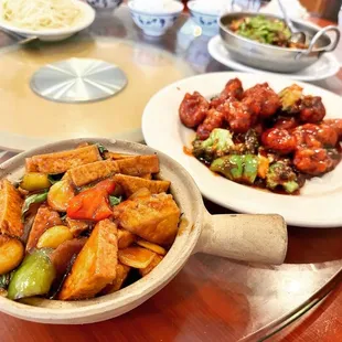a bowl of stir fried tofu and a bowl of stir fried tofu