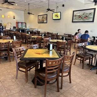 customers sitting at tables and eating