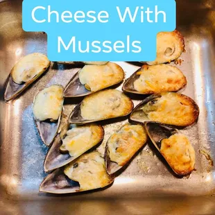 a pan of mussels with cheese