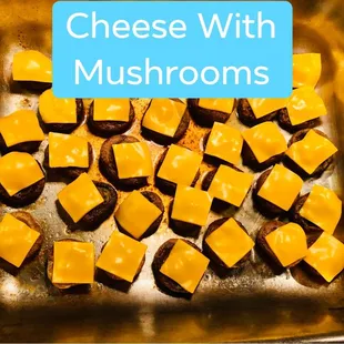 a pan of cheese with mushrooms