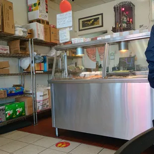 Small place with a handful of tables and a clean steam tray area.
