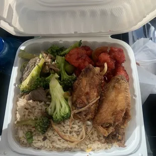 chicken, rice, broccoli, and tomatoes in a styrofoam container