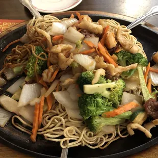 a plate of noodles and vegetables