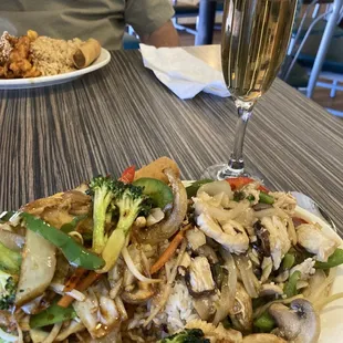Lunch combo with stir fried vegetables &amp; ginger chicken with steamed rice &amp; a spring roll. 4 ounce glass of Takara plum wine.