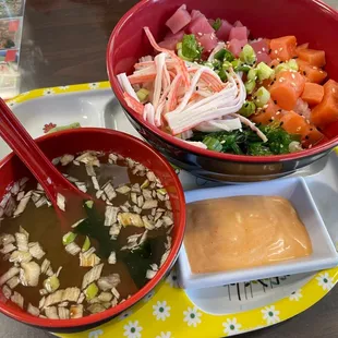 a bowl of soup and a bowl of soup with chopsticks