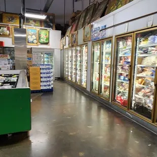 a grocery store with refrigerators and food