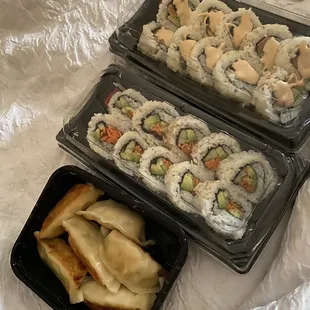 Dumplings, vegetable roll, spicy roll with salmon