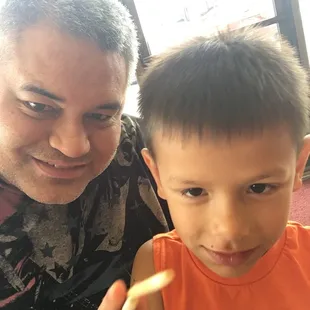 Picking up the best take out in Wichita! Teaching my son how to use chop sticks while waiting.