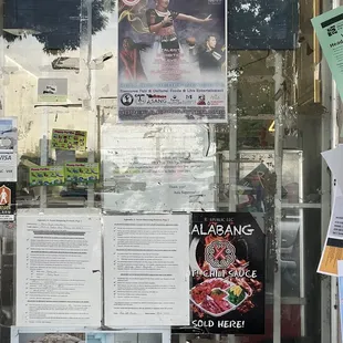 posters on the window of a store